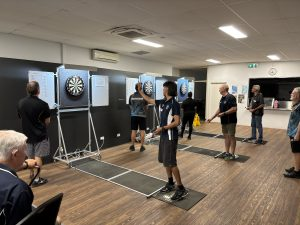 Weekly darts event featuring competitive gameplay